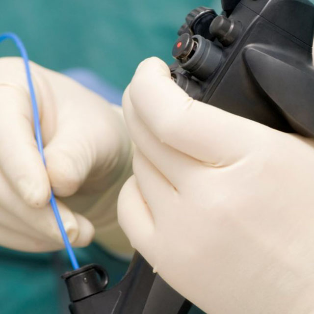 hands holding endoscope, suggesting transoral incisionless fundoplication procedure