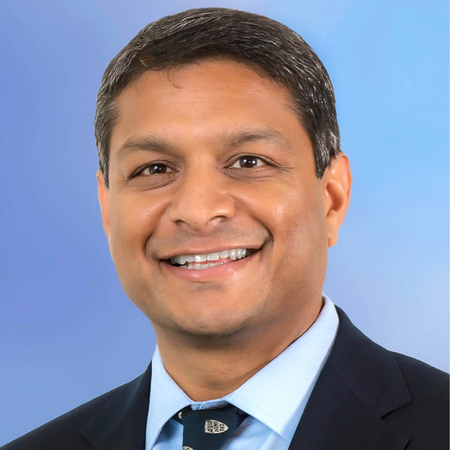 A photo shows Sanjay Desai.