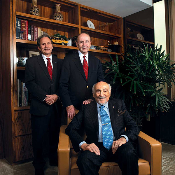 So much to celebrate! From left: William Isaacs , Patrick Walsh with philanthropist Bernard Schwartz (seated). 