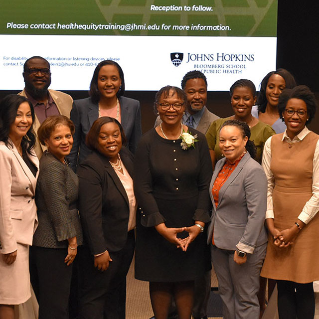 Group shot of panelists at a racial disparities event. 