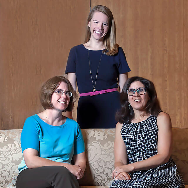 From left, Gail Berkenblit, Heather Sateia and Rachel Levine meet to discuss recruitment near a portrait of medical school benefactress Mary Elizabeth Garrett.