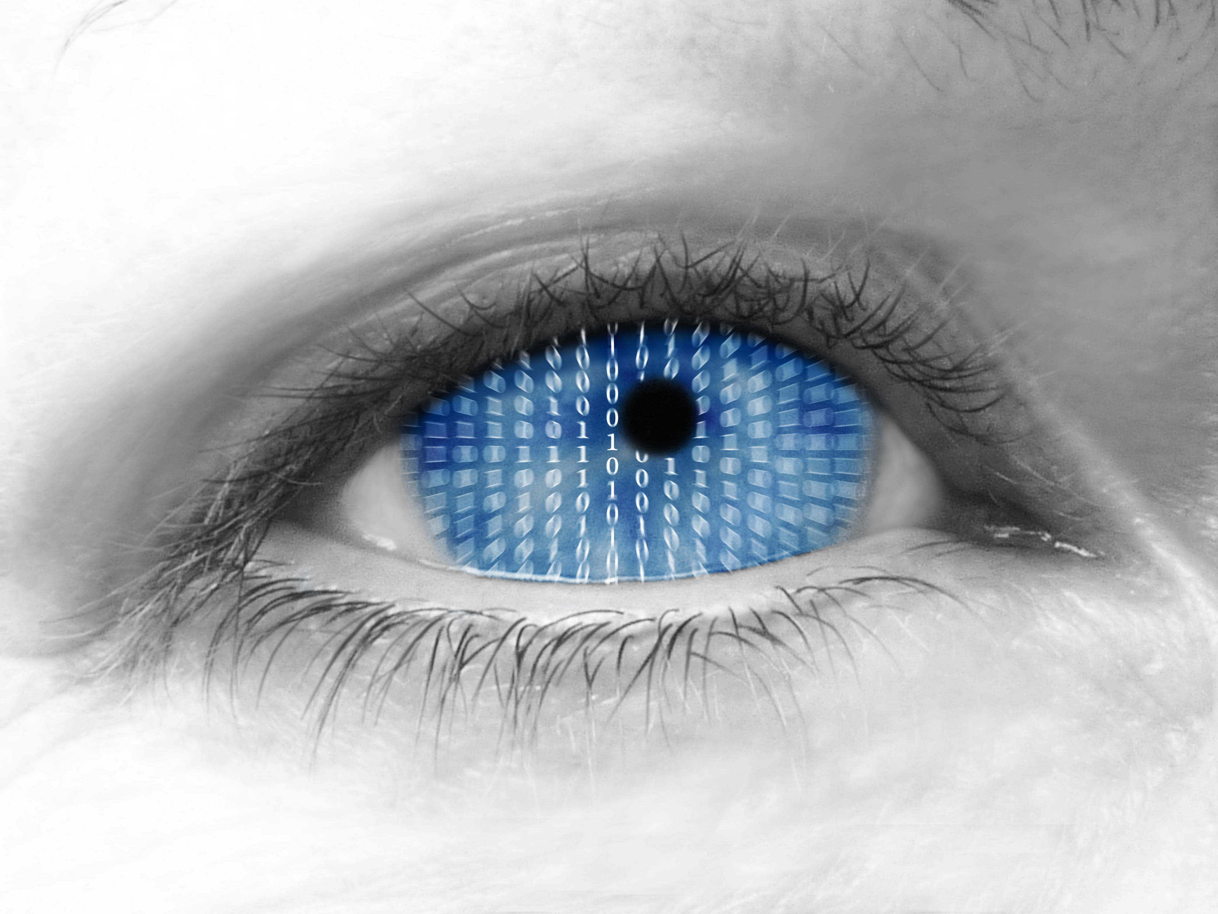 Close up of eye with binary code inside