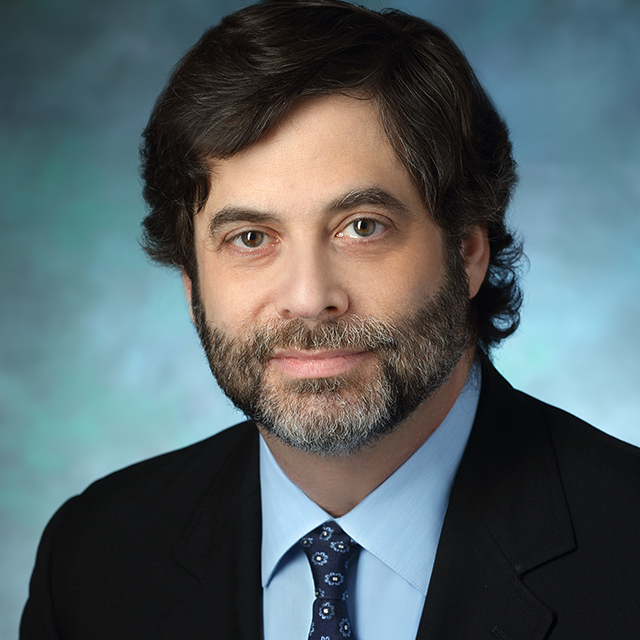 A photo shows Dr. Adam Kaplin