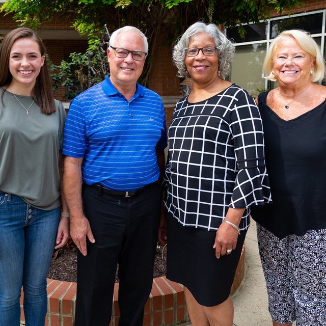 Pamela Fogan, Suburban Hospital’s director of volunteer services, is shown with volunteers Kayla Cesone, Howard Gilson and Nancy Walsh.