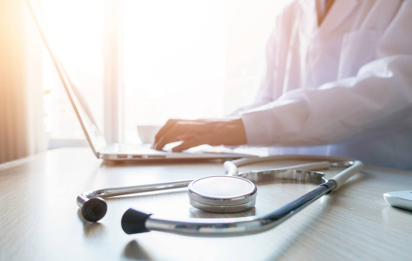 doctor looking at computer