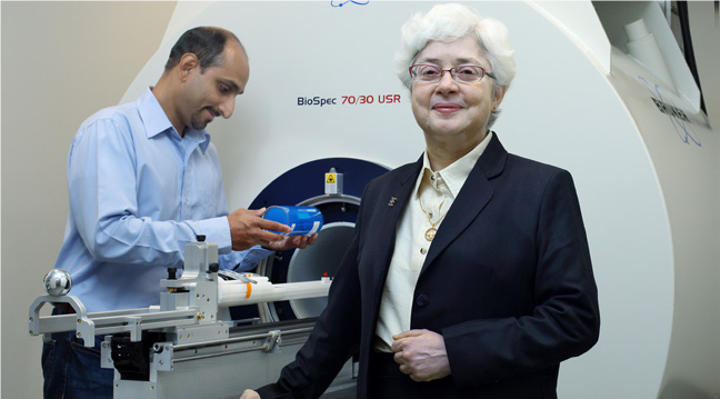 dr. bhujwalla in front of PET-MR scanner.