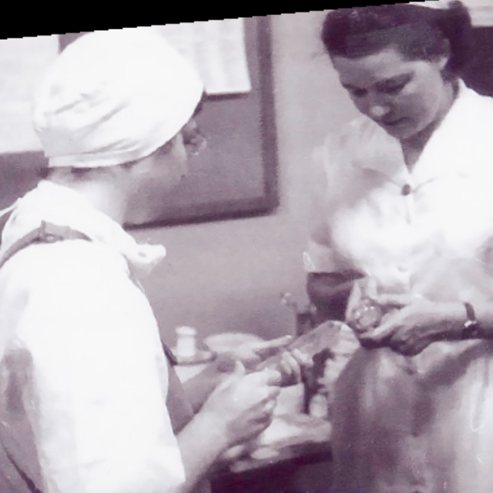 radiologist with nurse filling a glass syringe