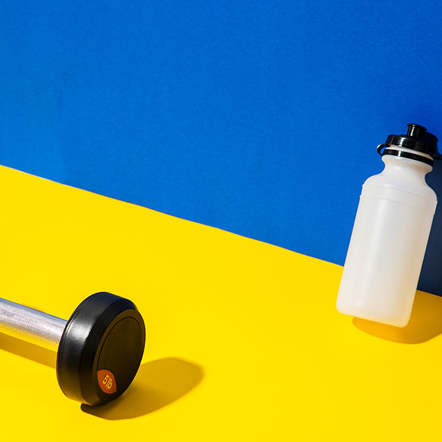stylized image of a weight and water bottle. 