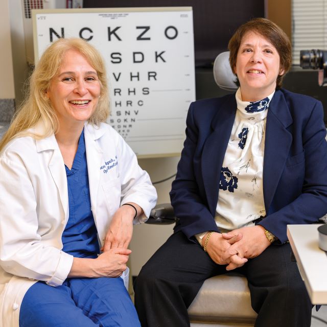 Esen Akpek with Leslie Pfenninger at afollow-up appointment at the Wilmer Eye Institute.