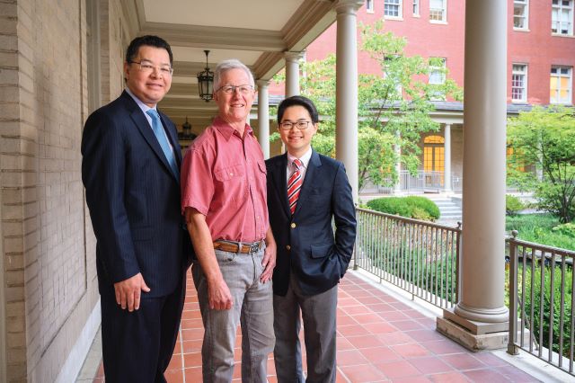 Geoffrey Grubbs stands outside of the Johns Hopkins Hospital with his doctors, Fernando Arevalo and T.Y.  Alvin Liu.