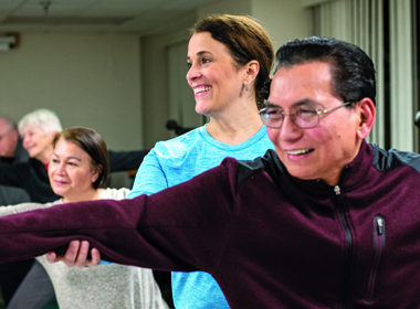 Karin Bertozzi leads a Yoga From the Heart class — a gentle yoga class designed for cardiac patients — at Suburban Hospital.