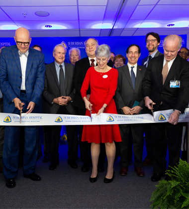 Image of ribbon-cutting ceremony with Kevin Sowers, Jacky Schultz and Chuck Wiebe, Chair, Suburban Hospital Board of Trustees