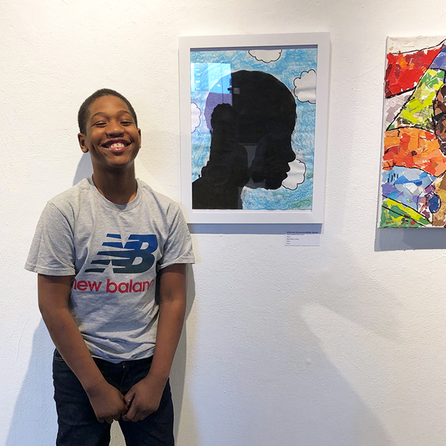 Student Anthony Forbes Jr. with his artwork