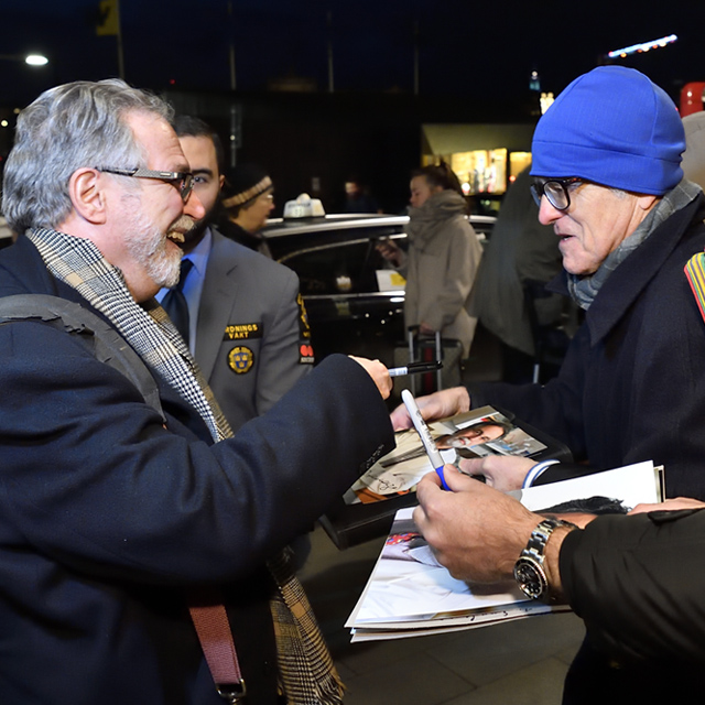 Nobel Prize winner Greg Semenza signs autograph in Stockholm. 