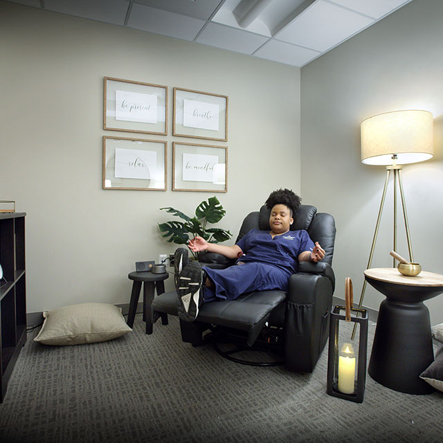 Elarnta Darden, a nurse on Nelson 5, relaxes in the unit’s newly created Zen retreat. 