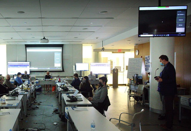 Ty Crowe, director of spiritual care for The Johns Hopkins Hospital, leads a meditation session in the Unified Incident Command Center.