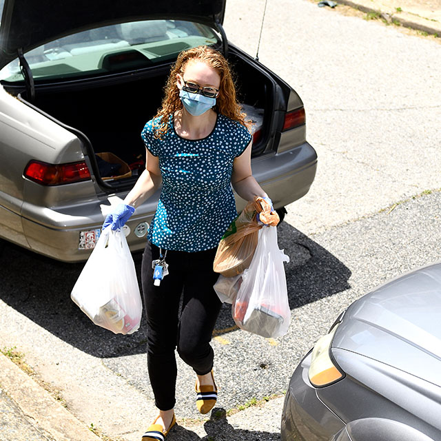 Medical student Laura Pugh, co-founder of Apart Not Alone, delivers groceries every Saturday to a West Baltimore woman who is homebound.