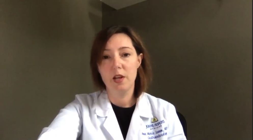 Anne Marie Lennon in white coat looking into camera
