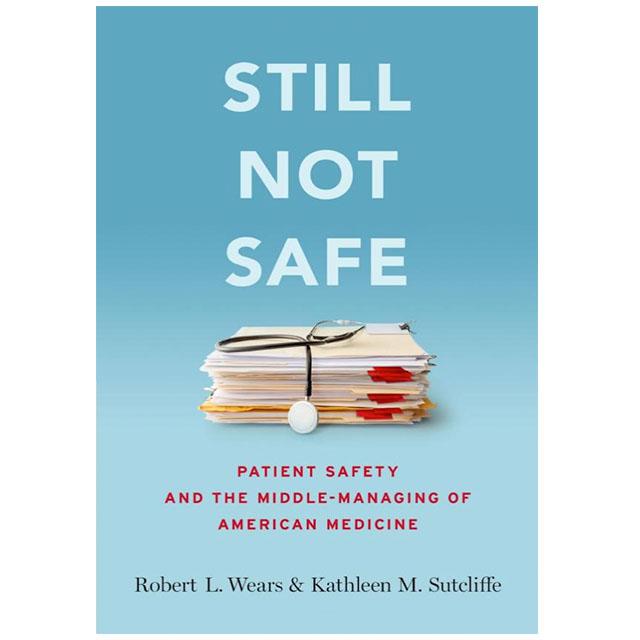 Cover of Still not Safe, showing a stack of files with a stethescope on top