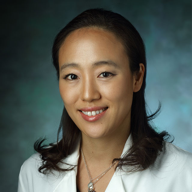 head shot of Dr. Chung, wearing a white lab coat