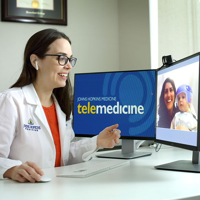 Pediatrician Helen Hughes uses telemedicine to treat a child