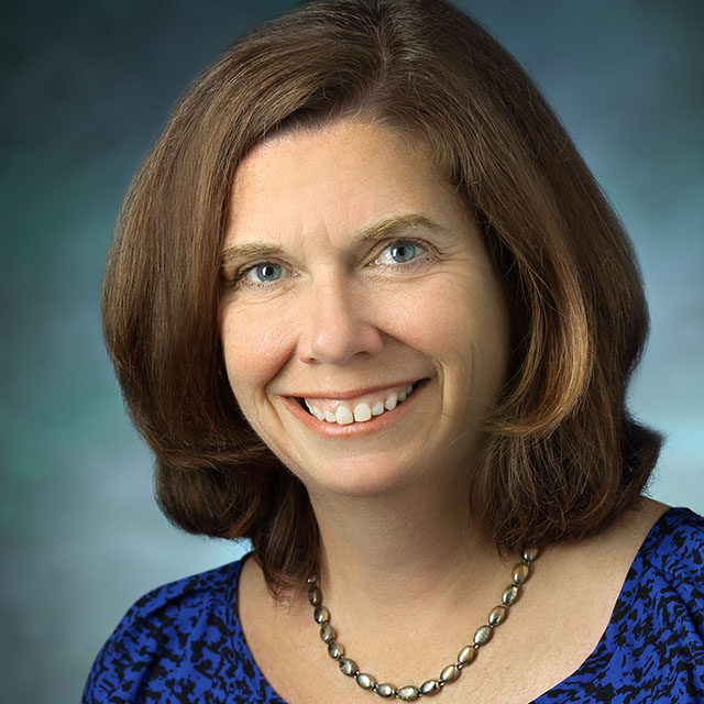 head shot of a smiling Sue DePasquale