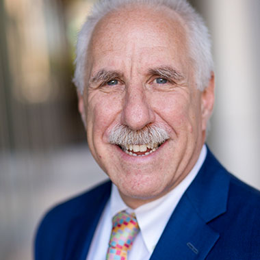 head shot of smiling Dr. Rothman