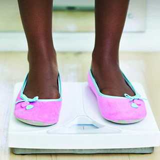 Woman's legs on a scale. 
