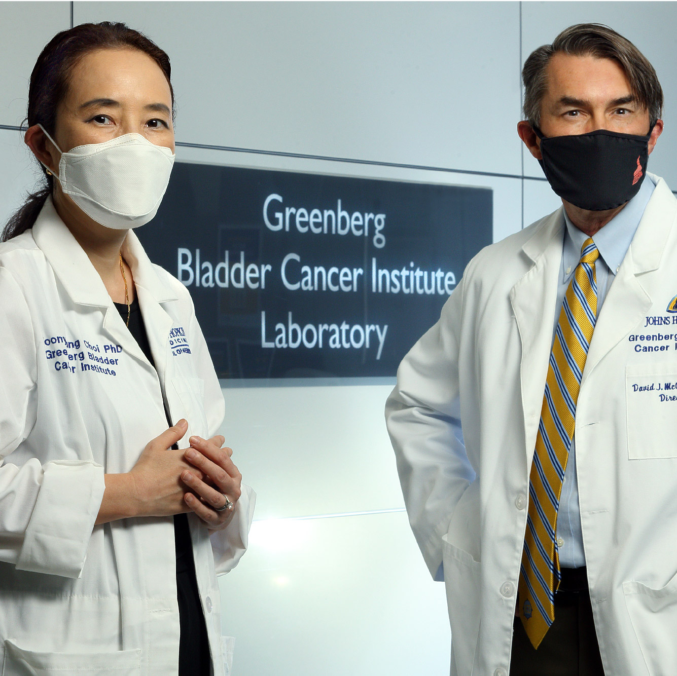 Choi, M.S., Ph.D., and David McConkey, Ph.D. standing together