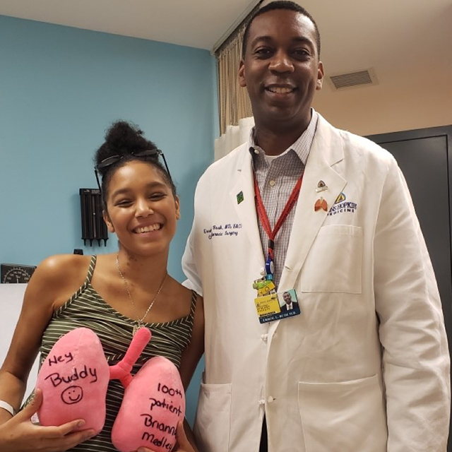 Photo shows Brianna Fogelman with transplant surgeon Errol Bush
