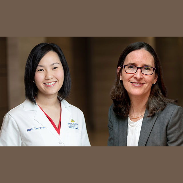 breast surgeons Maureen O'Donnell and Hanh-Tam Tran, standing next to each other and smiling