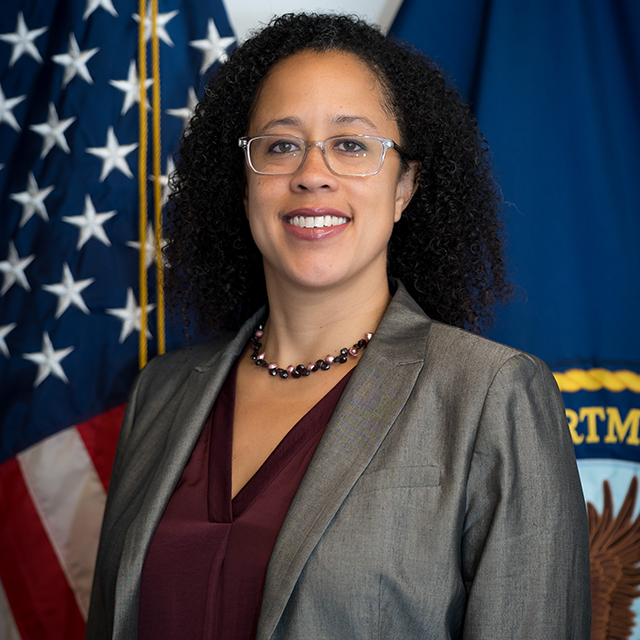Portrait of Kameron Matthews in front of the US flag