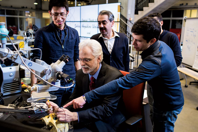 Peter Gehlbach and engineers in the lab