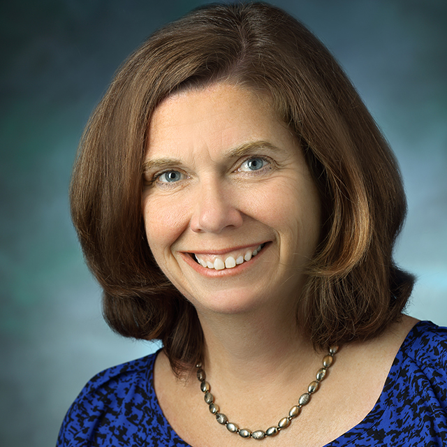 head shot of smiling Sue DePasquale