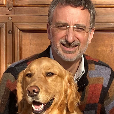Patrick Petit in the sun with his golden retriever, Apollo.
