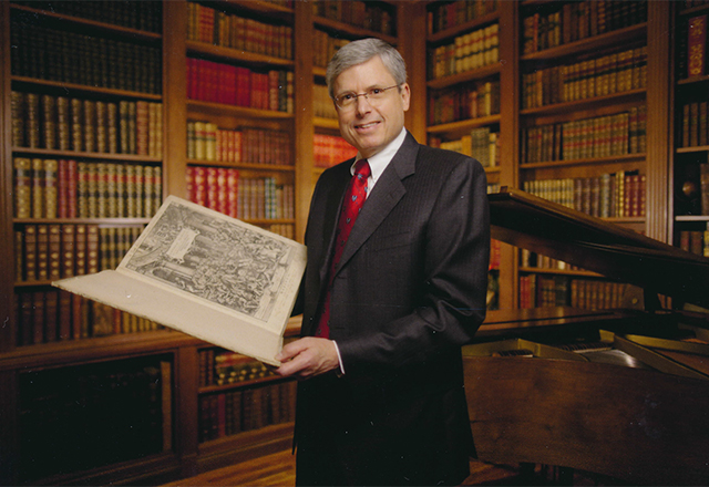 Bruce Fye with his books.