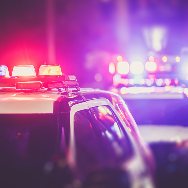 Photo of Police cars with flashing lights