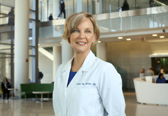 Dr. Karen Horton standing in the lobby at Johns Hopkins Hospital.