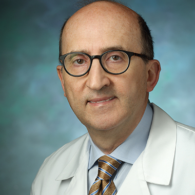 Portrait of Ahmet Gurakar in white coat. 
