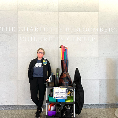 Music therapist Kerry Devlin with her music therapy cart, which holds a number of instruments patients can play.