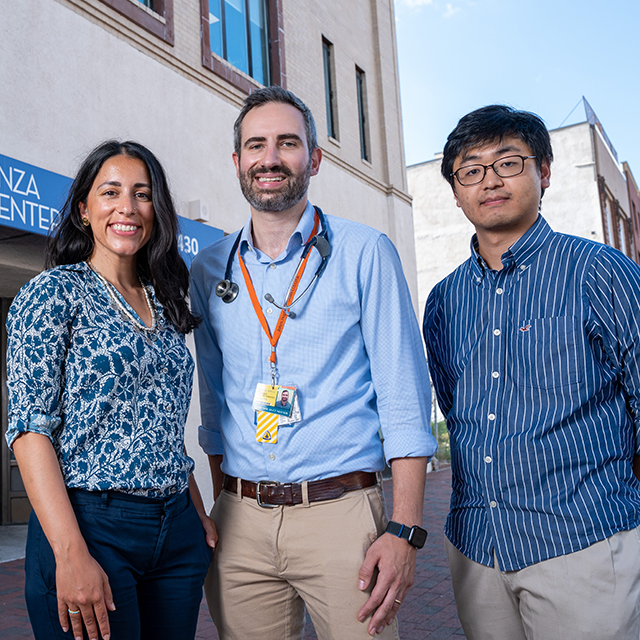 Nouf Bazaz, Nicholas Cuneo and J.J. Kim outside East Baltimore’s Esperanza Center before a busy HEAL clinic.