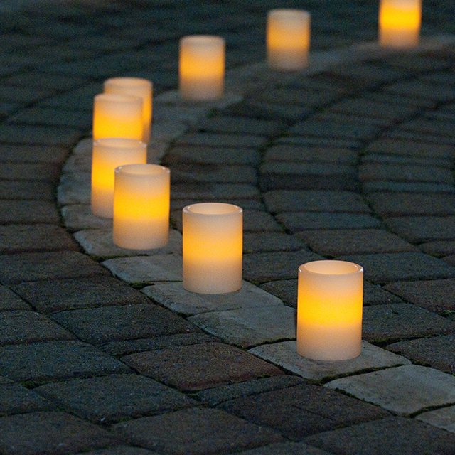 A set of candles arranged on a curve.