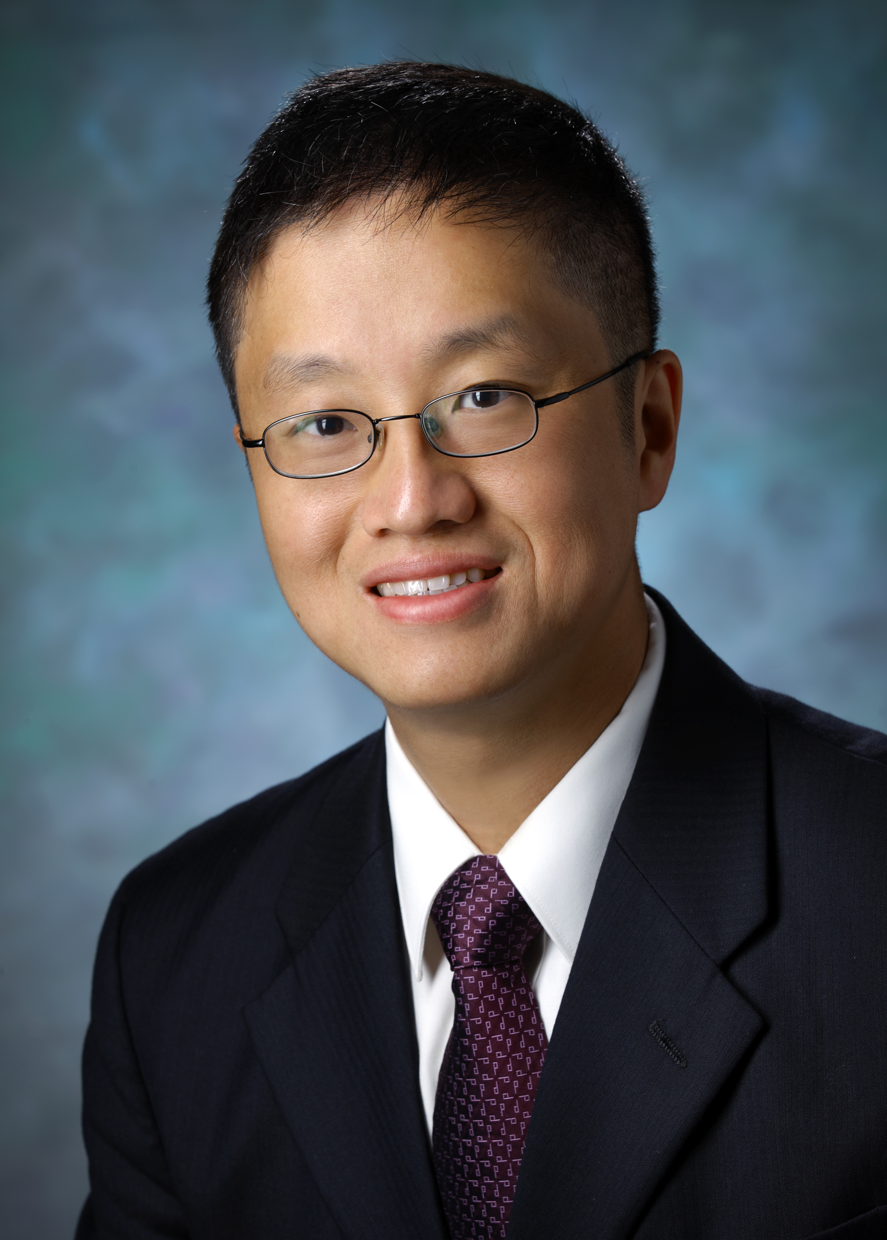 Shih-Chun “David” Lin, in a formal portrait, wearing a dark blue suit