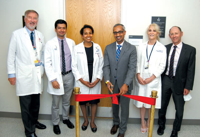 From left to right, Wilmer Director Peter J. McDonnell, AssistantChief of Service Kapil Mishra, Residency Director FasikaWoreta, alum Parag Parekh (cutting the ribbon), faculty members Esen Akpek and Henry Jampel at the Residents Workroom dedication