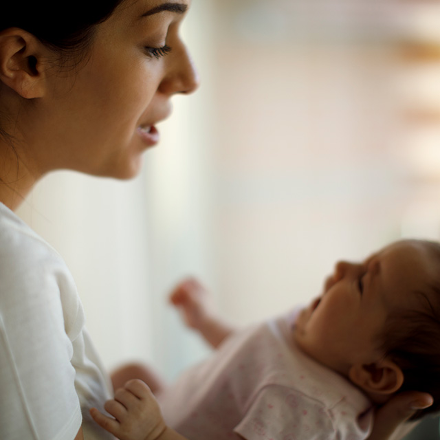 Image of woman holding infant.