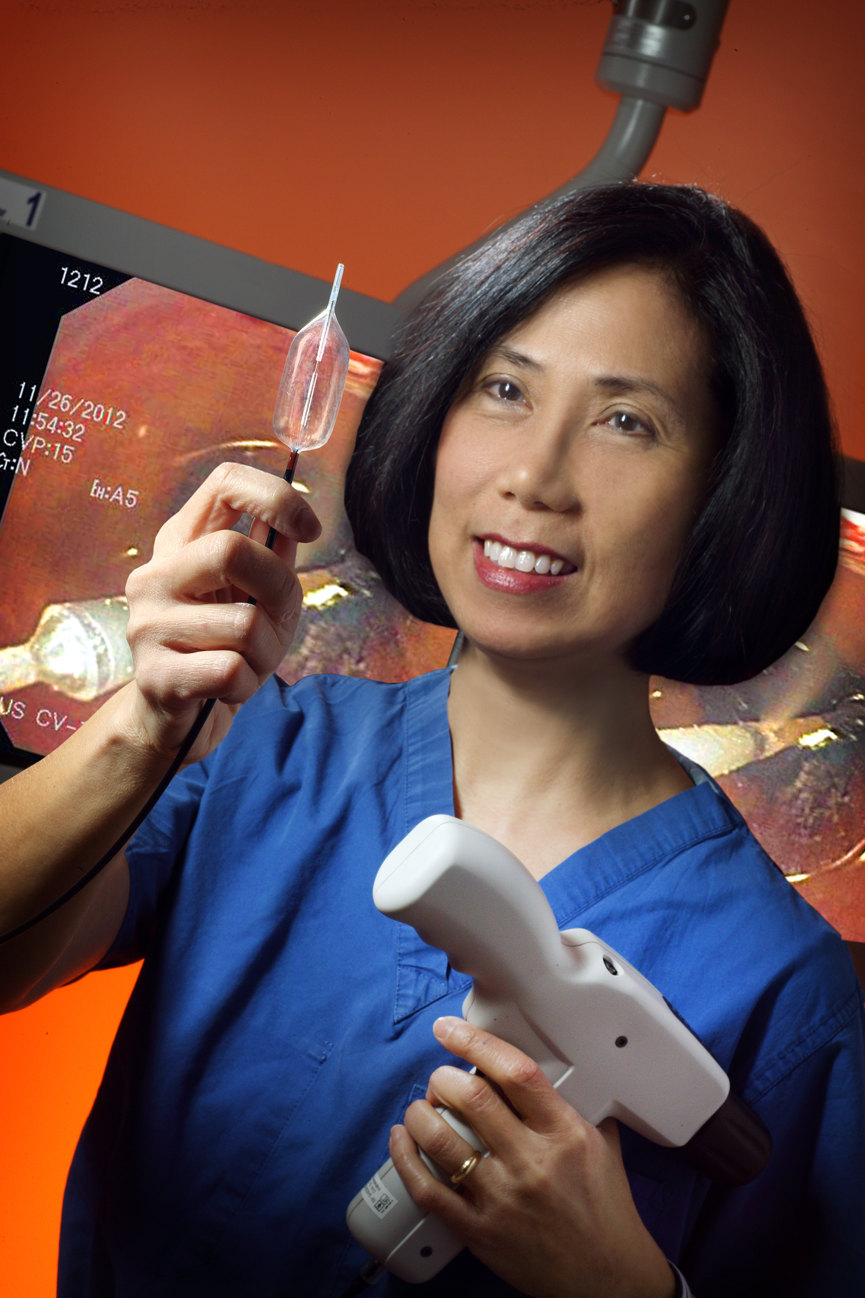 Portrait of Mimi Canto holding a cryoballoon device.