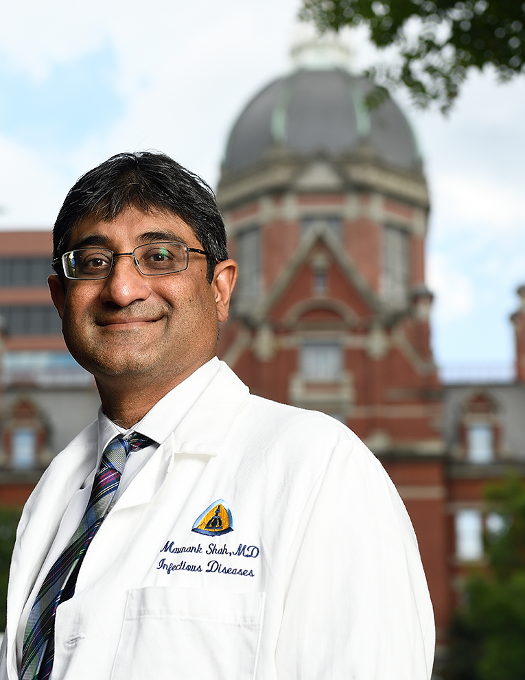 Shah stands in front of the Johns Hopkins Billings Building