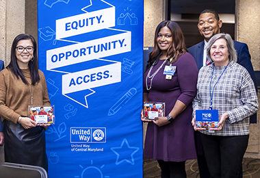 Johns Hopkins Interim Dean and CEO Theodore DeWeese and President and Executive Vice President Kevin Sowers join with Franklyn Baker, president and CEO of United Way of Central Maryland, and four Johns Hopkins United Way steering campaign award winners.