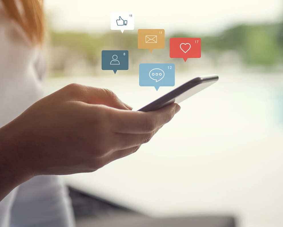 cell phone image with social media icon graphics