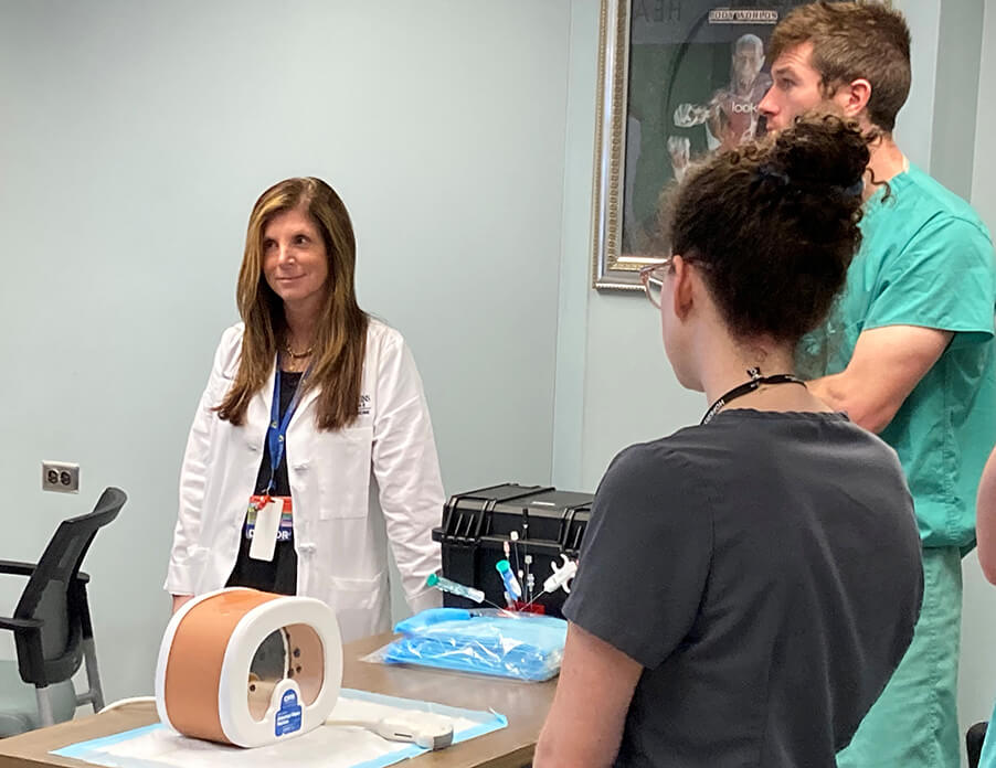 Pamela Johnson and residents at the ultrasound simulation lab opening